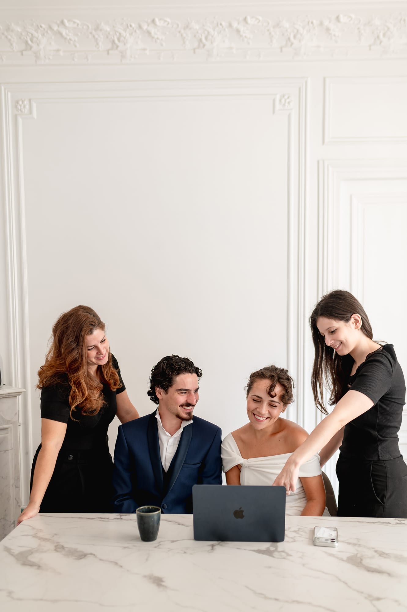 The Maison.S Wedding team walking a couple through their Client Portal