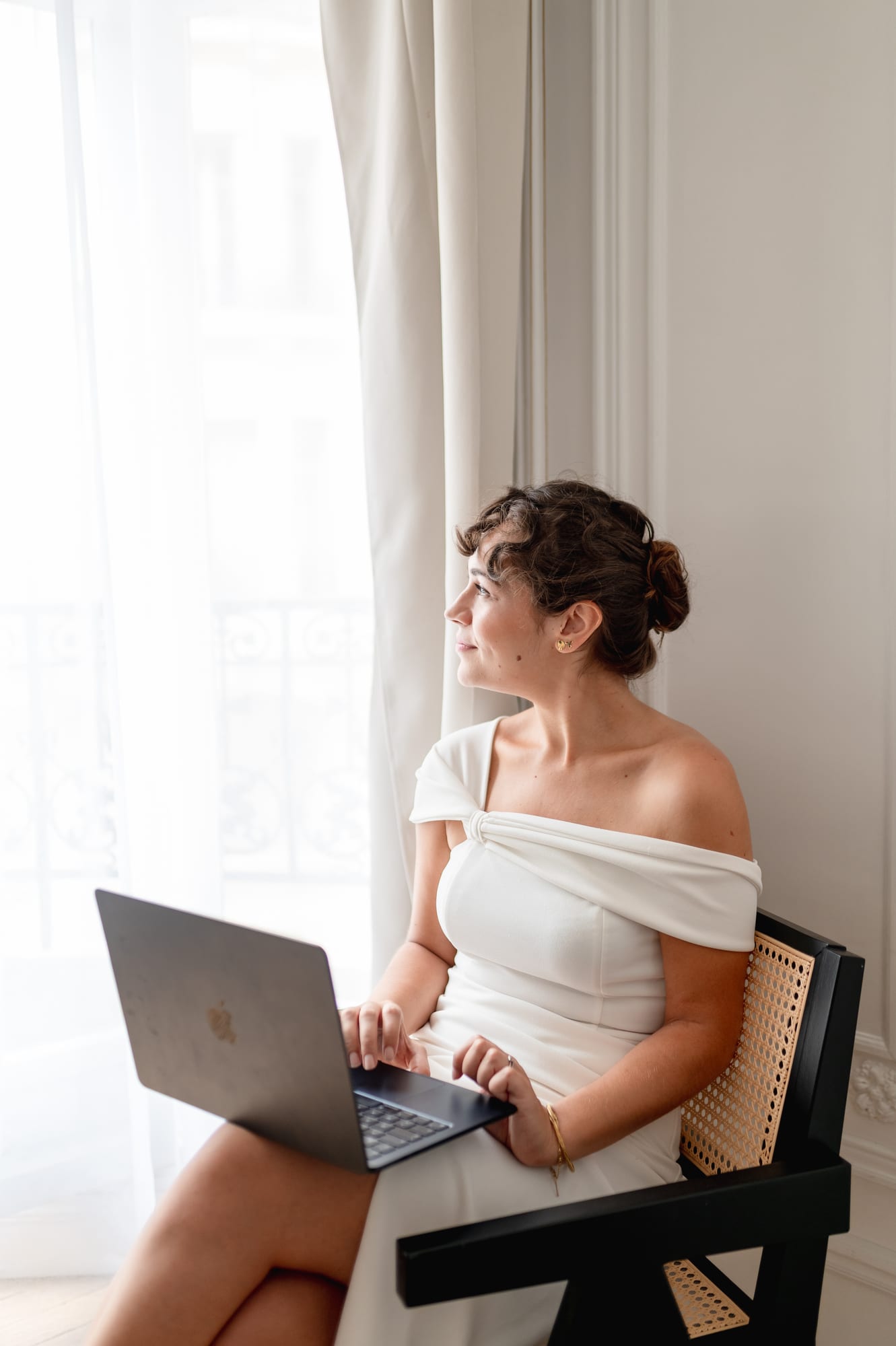 A bride planning her wedding from her computer