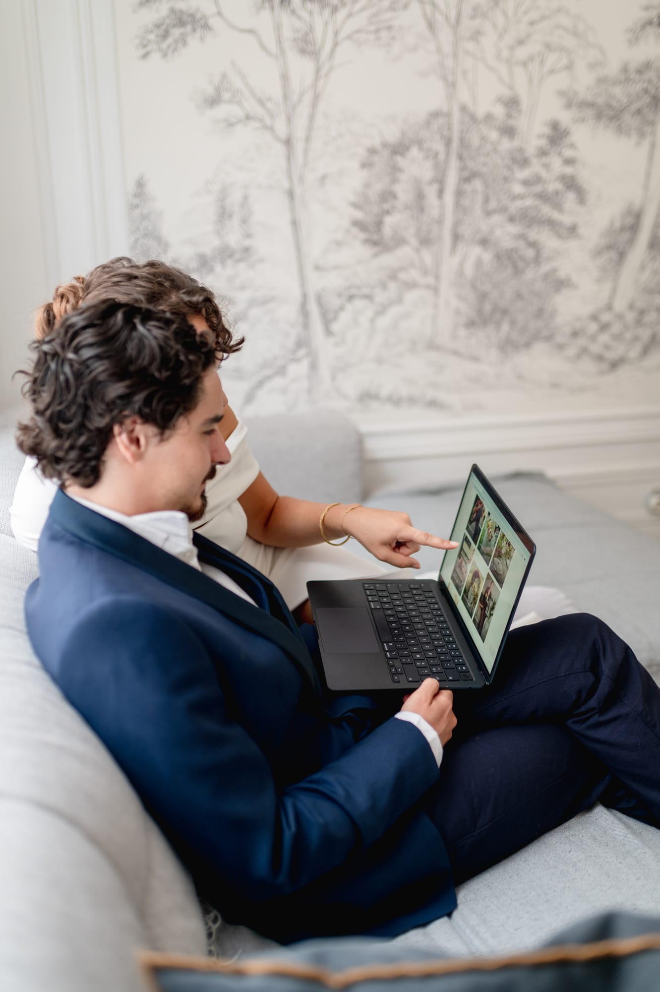 A couple browsing their Client Portal on a laptop